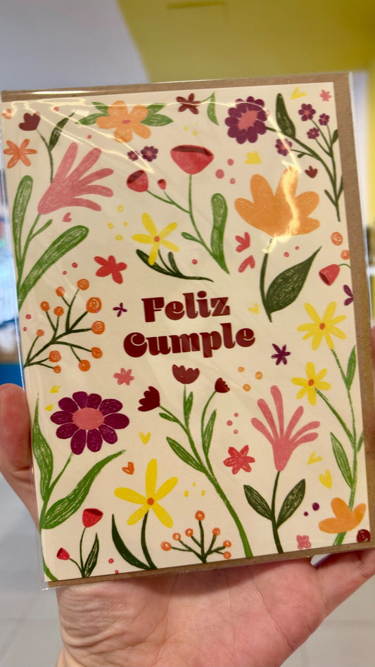 Tarjeta “Feliz cumple” con flores de colores