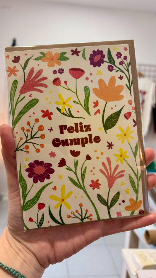 Tarjeta “Feliz cumple” con flores de colores